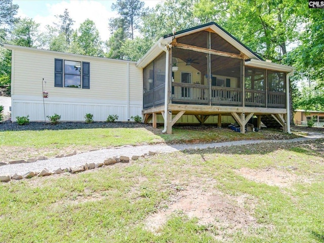 1989 White Oak Rd, Camden, SC 29020 - view of front of home with a sunroom, ceiling fan, and a front yard