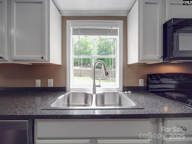 1989 White Oak Rd, Camden, SC 29020 - kitchen with a sink, black appliances, dark countertops, and white cabinetry