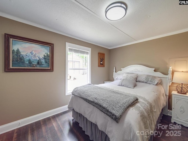 1989 White Oak Rd, Camden, SC 29020 - bedroom featuring baseboards, dark wood finished floors, crown molding, and a textured ceiling