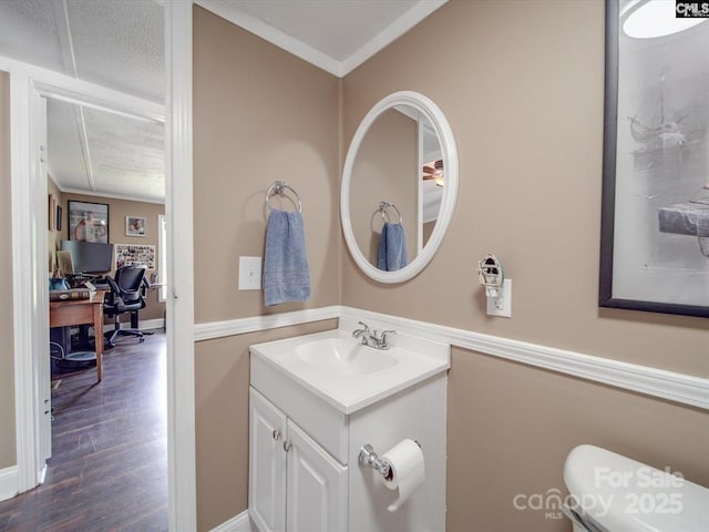 1989 White Oak Rd, Camden, SC 29020 - bathroom featuring vanity, wood finished floors, toilet, and ornamental molding
