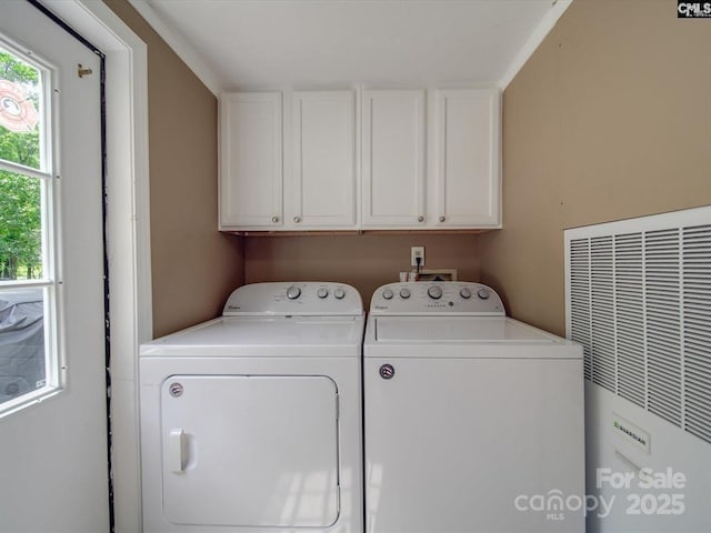 1989 White Oak Rd, Camden, SC 29020 - laundry area featuring a heating unit, washing machine and dryer, and cabinet space