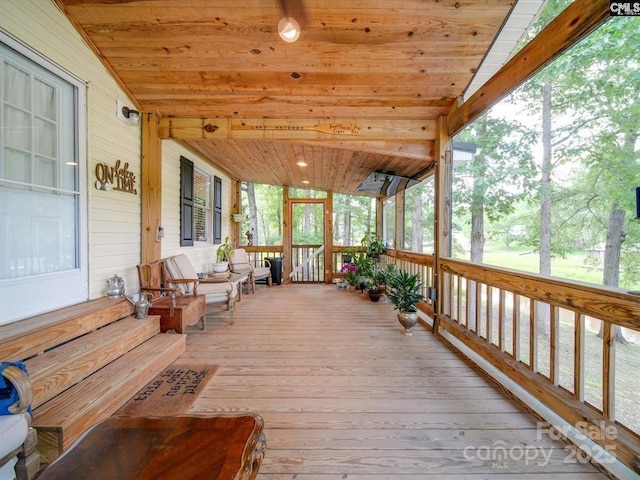 1989 White Oak Rd, Camden, SC 29020 - sunroom with wooden ceiling with exposed beams, hardwood / wood-style flooring, and wooden walls