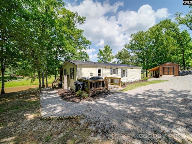 1989 White Oak Rd, Camden, SC 29020 - rear view of property with an outdoor structure and a deck