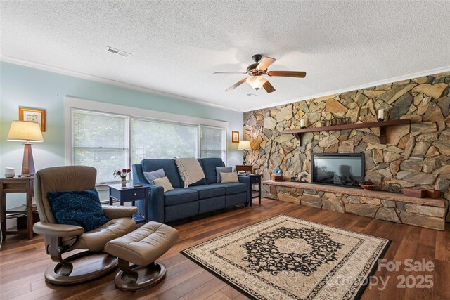 58 Campbell Creek Rd, Maggie Valley, NC 28751 - living area featuring crown molding, a textured ceiling, ceiling fan, and hardwood / wood-style floors