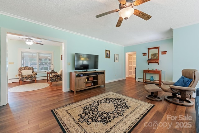 58 Campbell Creek Rd, Maggie Valley, NC 28751 - living room with crown molding, ceiling fan, wood finished floors, a textured ceiling, and a baseboard heating unit