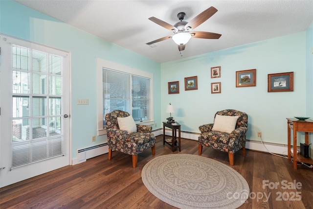 58 Campbell Creek Rd, Maggie Valley, NC 28751 - sitting room with baseboard heating, ceiling fan, wood finished floors, and a baseboard radiator