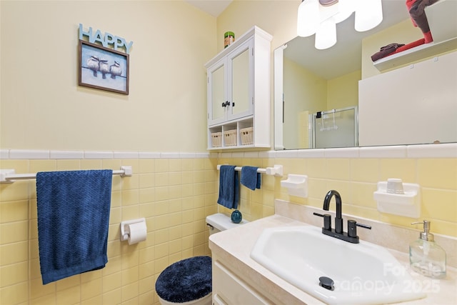 58 Campbell Creek Rd, Maggie Valley, NC 28751 - full bathroom featuring an enclosed shower, tile walls, vanity, and a wainscoted wall