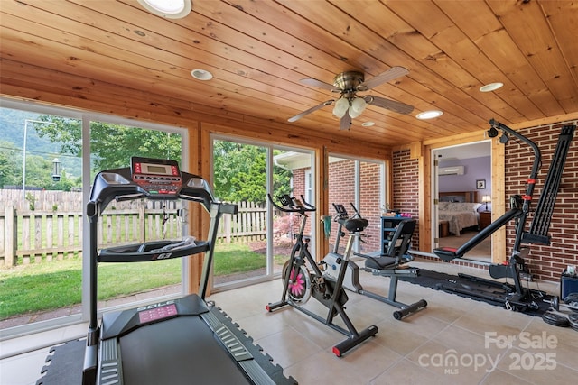 58 Campbell Creek Rd, Maggie Valley, NC 28751 - exercise area with healthy amount of natural light, wooden ceiling, ceiling fan, a wall mounted air conditioner, and tile patterned floors