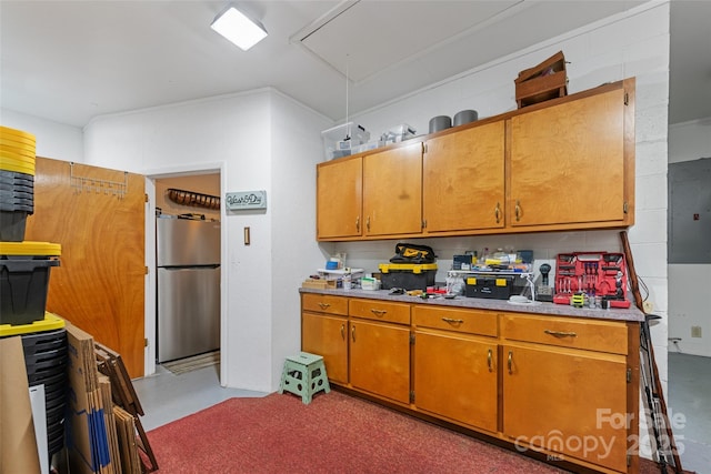 58 Campbell Creek Rd, Maggie Valley, NC 28751 - kitchen with freestanding refrigerator, light countertops, electric panel, and brown cabinets