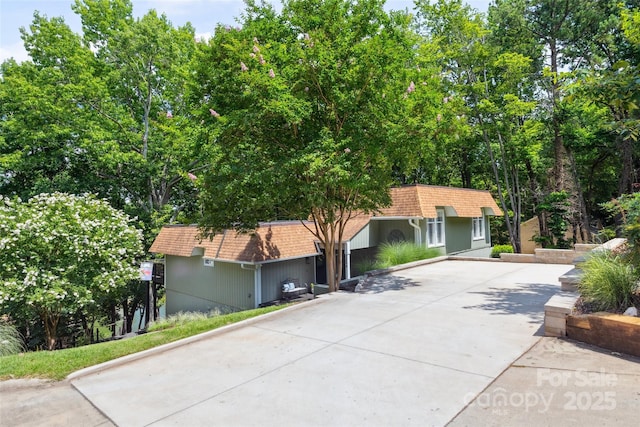 2004 Marquesas Ave, Tega Cay, SC 29708 - front facade with a shingled roof and mansard roof