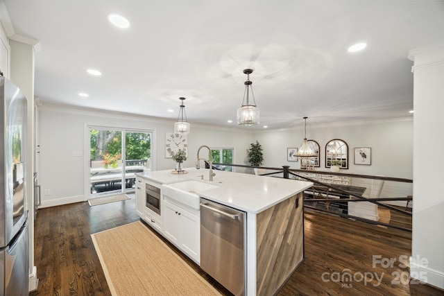 2004 Marquesas Ave, Tega Cay, SC 29708 - kitchen with stainless steel appliances, recessed lighting, white cabinets, a chandelier, and a center island with sink