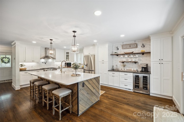 2004 Marquesas Ave, Tega Cay, SC 29708 - kitchen featuring beverage cooler, wall chimney range hood, stainless steel refrigerator with ice dispenser, backsplash, and dark wood-style flooring