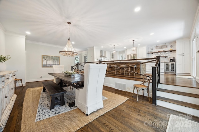 2004 Marquesas Ave, Tega Cay, SC 29708 - dining area featuring wine cooler, recessed lighting, dark wood-style flooring, a chandelier, and ornamental molding