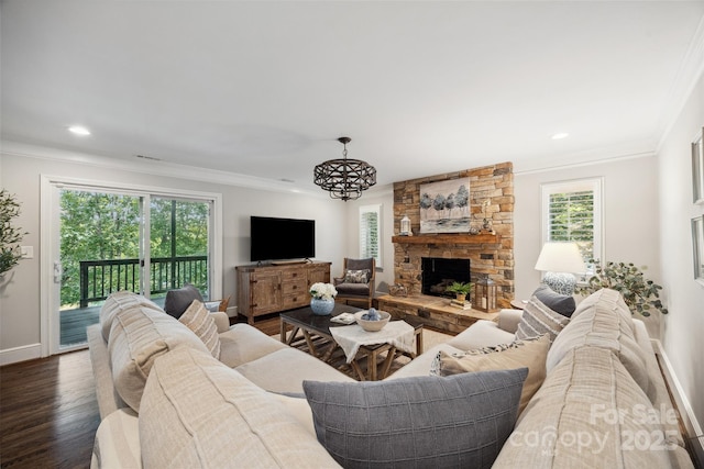 2004 Marquesas Ave, Tega Cay, SC 29708 - living area with ornamental molding, dark wood finished floors, a stone fireplace, and recessed lighting