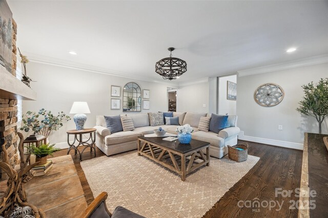 2004 Marquesas Ave, Tega Cay, SC 29708 - living area with dark wood-type flooring, ornamental molding, recessed lighting, and a stone fireplace