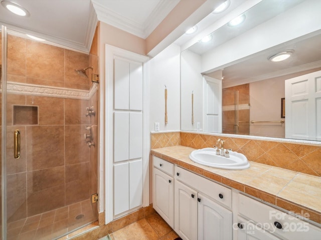 2442 Singleton Pt Unit 67, Liberty Hill, SC 29074 - bathroom featuring a shower stall, vanity, crown molding, and decorative backsplash