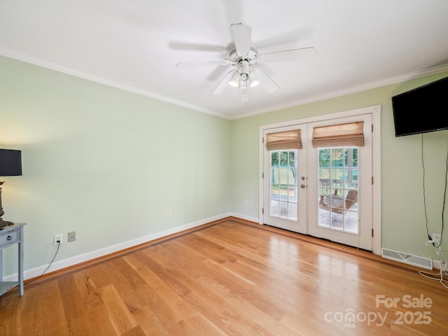 2442 Singleton Pt Unit 67, Liberty Hill, SC 29074 - unfurnished living room featuring french doors, a ceiling fan, ornamental molding, and wood finished floors