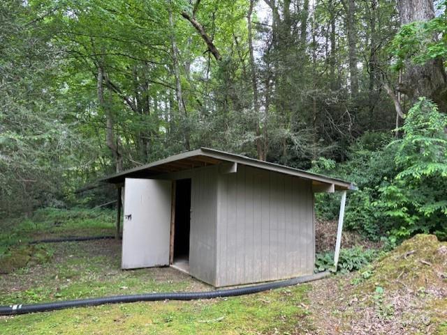 2070 Cashiers Valley Rd, Brevard, NC 28712 - view of shed featuring a wooded view