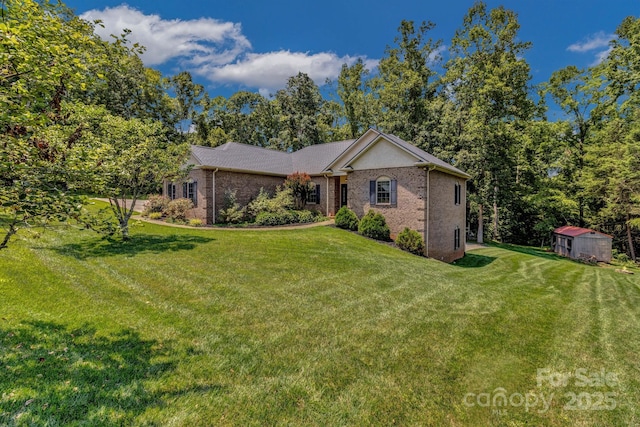 2790 Twin Oaks Dr, Morganton, NC 28655 - ranch-style home with a front lawn, a storage shed, and brick siding