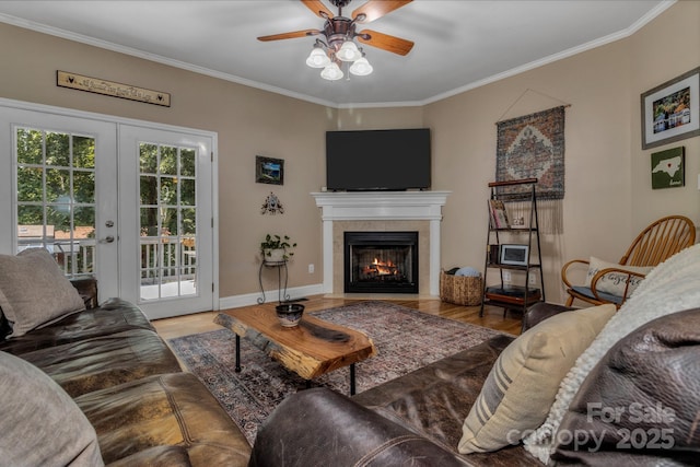 2790 Twin Oaks Dr, Morganton, NC 28655 - living room with wood finished floors, a ceiling fan, french doors, ornamental molding, and a tile fireplace