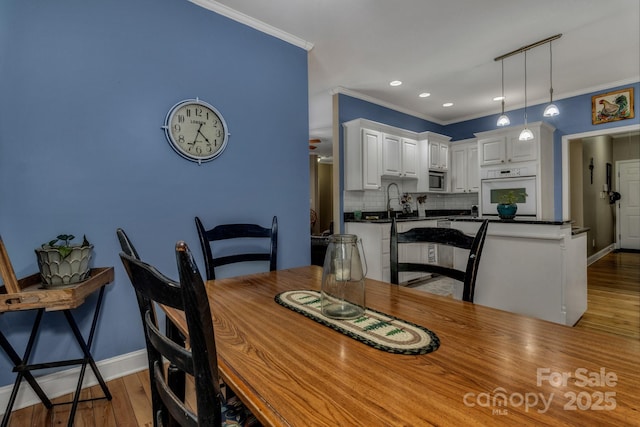2790 Twin Oaks Dr, Morganton, NC 28655 - dining area with ornamental molding, wood finished floors, and recessed lighting
