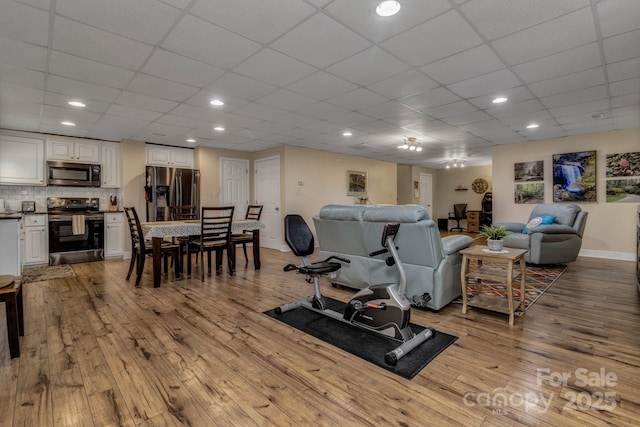 2790 Twin Oaks Dr, Morganton, NC 28655 - living area featuring wood-type flooring and a drop ceiling
