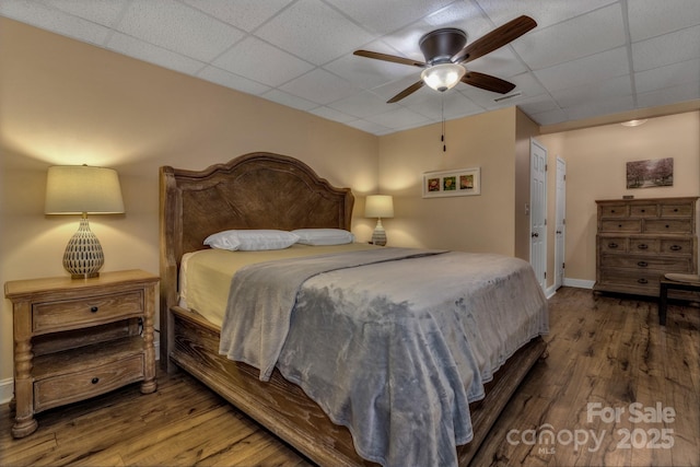 2790 Twin Oaks Dr, Morganton, NC 28655 - bedroom with wood finished floors, a paneled ceiling, and ceiling fan