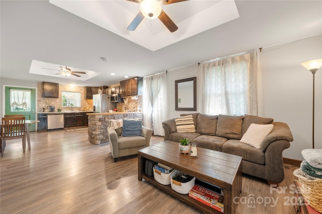1116 S Juniper St, Kannapolis, NC 28081 - living area featuring ceiling fan, a tray ceiling, wood finished floors, and recessed lighting
