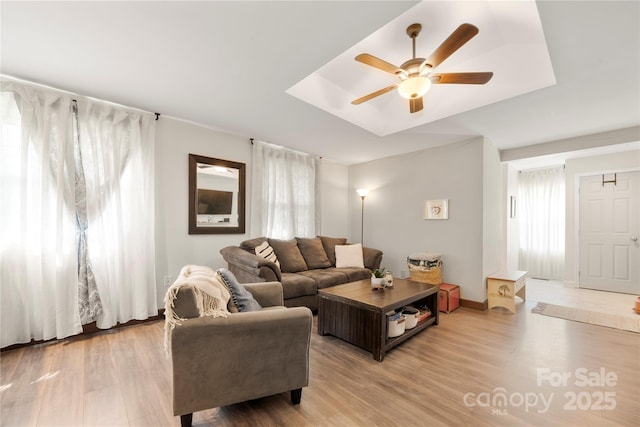 1116 S Juniper St, Kannapolis, NC 28081 - living room featuring ceiling fan, light wood-type flooring, and baseboards