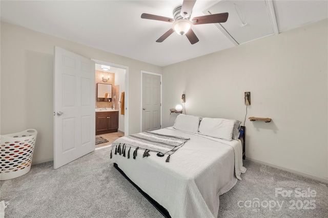 1116 S Juniper St, Kannapolis, NC 28081 - bedroom with light carpet, baseboards, ceiling fan, and ensuite bathroom