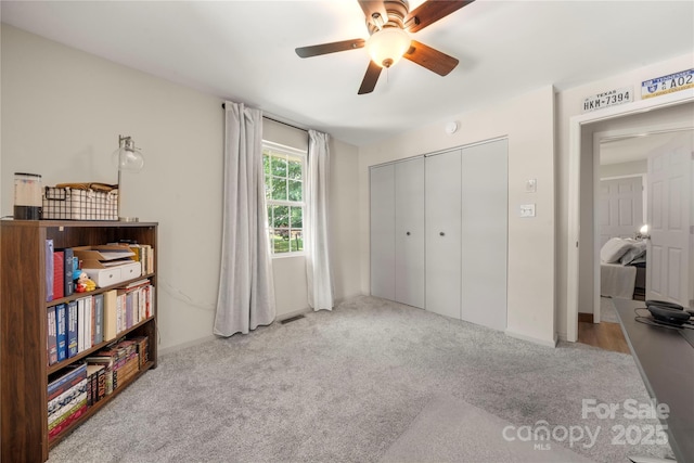 1116 S Juniper St, Kannapolis, NC 28081 - carpeted bedroom with a closet, a ceiling fan, and baseboards
