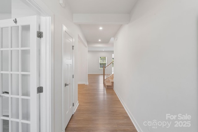 207 Welcombe St, Mooresville, NC 28115 - hallway with wood finished floors, stairs, recessed lighting, and baseboards