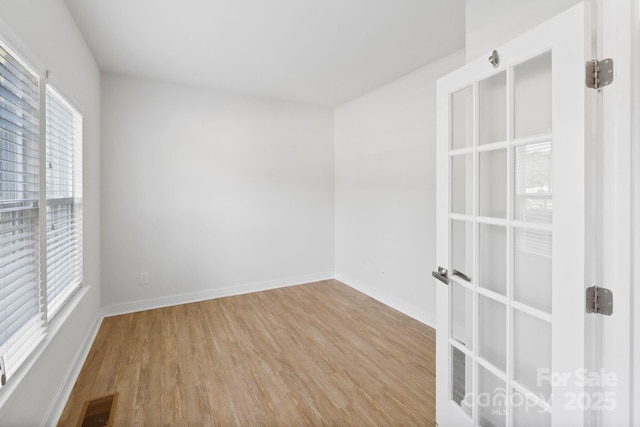 207 Welcombe St, Mooresville, NC 28115 - spare room featuring wood finished floors and baseboards