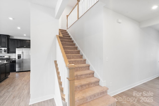 207 Welcombe St, Mooresville, NC 28115 - staircase featuring recessed lighting, wood finished floors, and baseboards