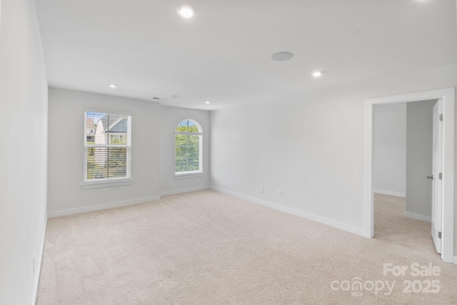 207 Welcombe St, Mooresville, NC 28115 - spare room featuring light carpet, recessed lighting, and baseboards