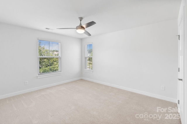 207 Welcombe St, Mooresville, NC 28115 - unfurnished room with a ceiling fan, light carpet, and baseboards