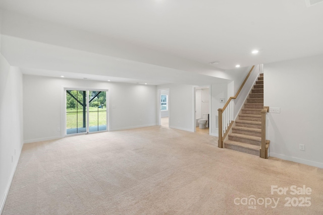 207 Welcombe St, Mooresville, NC 28115 - unfurnished living room featuring light colored carpet, stairway, recessed lighting, and baseboards