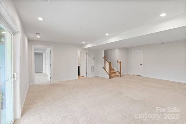 207 Welcombe St, Mooresville, NC 28115 - below grade area with light carpet, stairs, recessed lighting, and baseboards