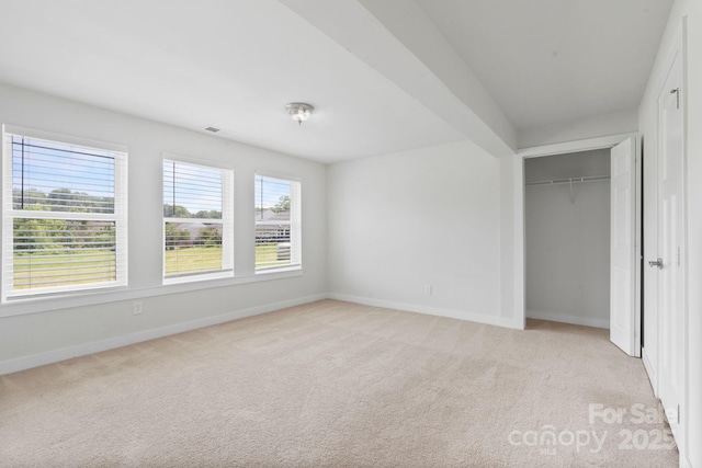 207 Welcombe St, Mooresville, NC 28115 - unfurnished bedroom with baseboards, light carpet, and a closet