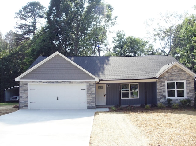1802 Cooper Ave, Kannapolis, NC 28081 - view of front of house with stone siding, concrete driveway, an attached garage, a shingled roof, and a porch