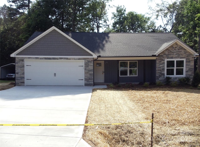 1802 Cooper Ave, Kannapolis, NC 28081 - view of front of home with stone siding, concrete driveway, a garage, and a shingled roof