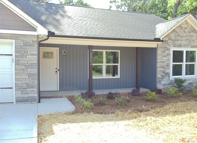 1802 Cooper Ave, Kannapolis, NC 28081 - doorway to property with stone siding, a porch, and a shingled roof