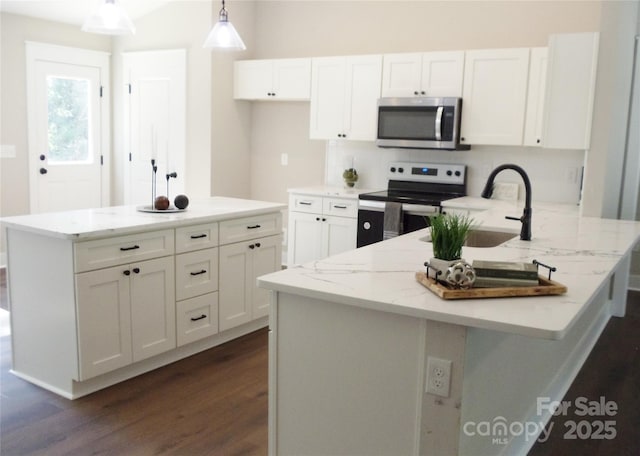 1802 Cooper Ave, Kannapolis, NC 28081 - kitchen featuring stainless steel microwave, electric stove, a sink, and white cabinets