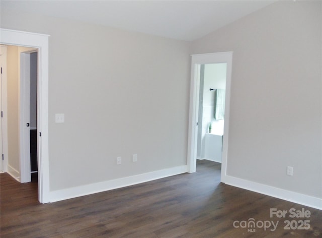 1802 Cooper Ave, Kannapolis, NC 28081 - spare room with dark wood finished floors, baseboards, and vaulted ceiling