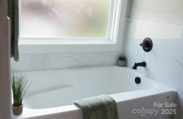 1802 Cooper Ave, Kannapolis, NC 28081 - bathroom featuring a bathtub and plenty of natural light