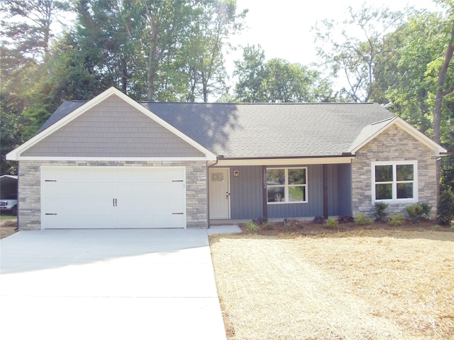 1802 Cooper Ave, Kannapolis, NC 28081 - view of front of property featuring stone siding, driveway, a garage, a shingled roof, and covered porch