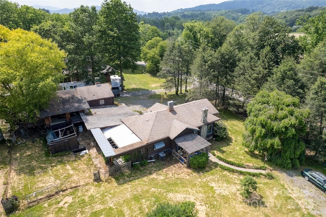 3960 Old Clyde Rd, Clyde, NC 28721 - aerial view of property and surrounding area with a heavily wooded area and a mountainous background