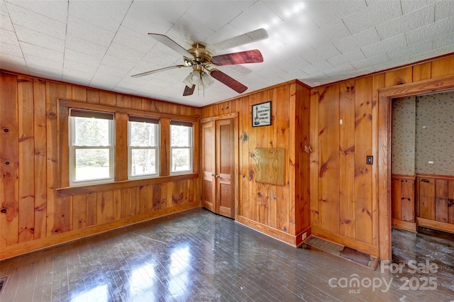 3960 Old Clyde Rd, Clyde, NC 28721 - unfurnished room featuring wood walls, ceiling fan, and wood finished floors