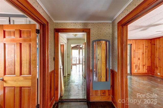 3960 Old Clyde Rd, Clyde, NC 28721 - hallway featuring wallpapered walls, wood finished floors, crown molding, and a wainscoted wall