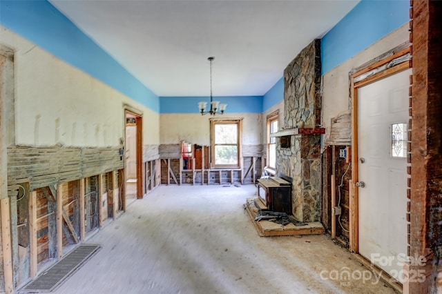 3960 Old Clyde Rd, Clyde, NC 28721 - living room featuring a chandelier and a wood stove
